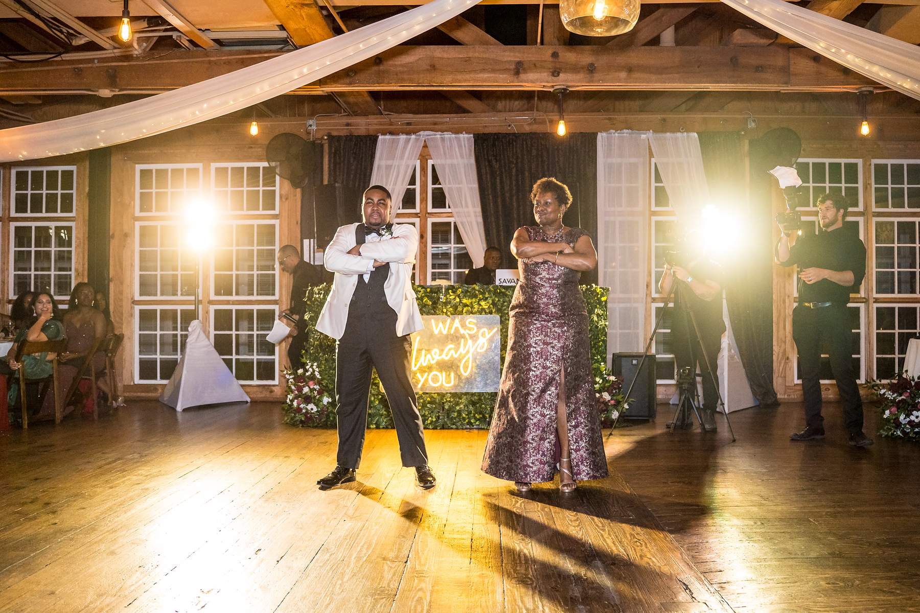 Groom dancing with a family member at an Ivy Hall at Roswell Mill reception