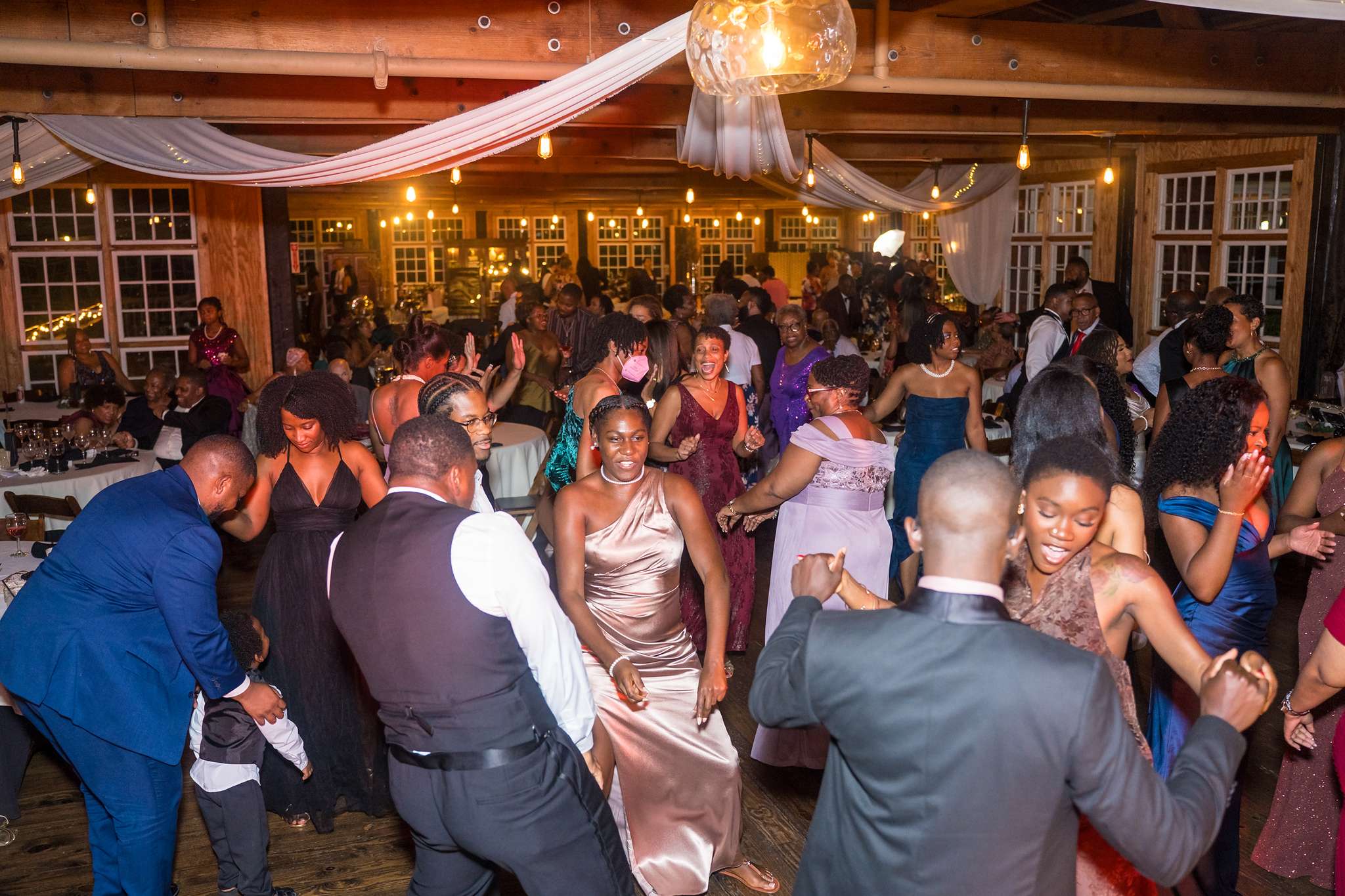 Guests dancing at an Ivy Hall at Roswell Mill wedding reception