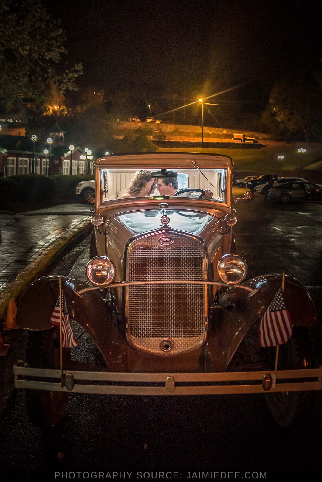 Ivy Hall Roswell Wedding Pictures - couple in old time car at night