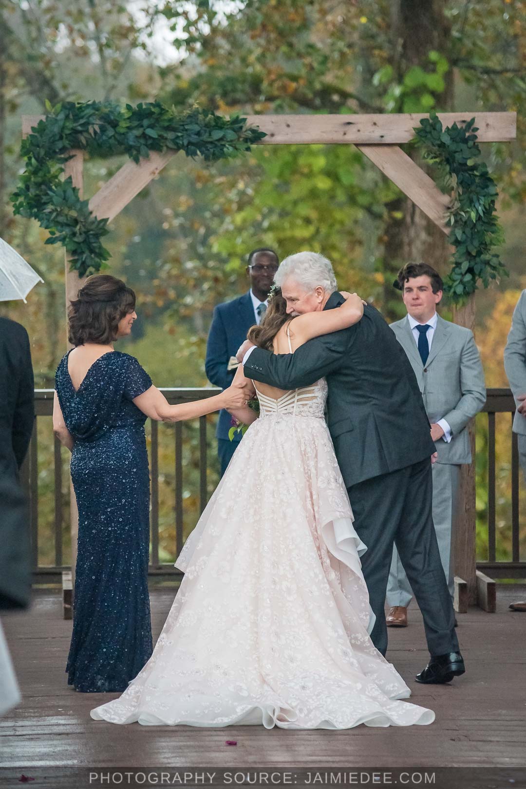 Ivy Hall Roswell Wedding Pictures - bride hugging father during ceremony