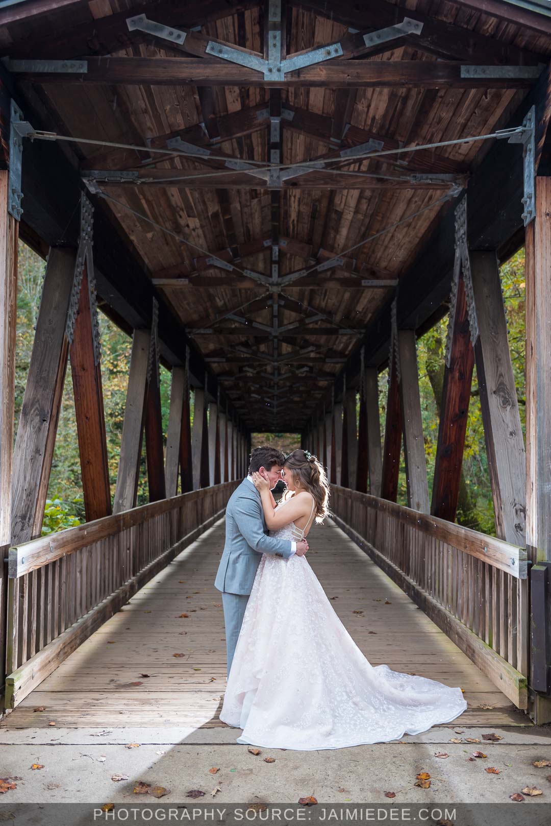 Ivy Hall Roswell Wedding Pictures - couple on vickery creek bridge