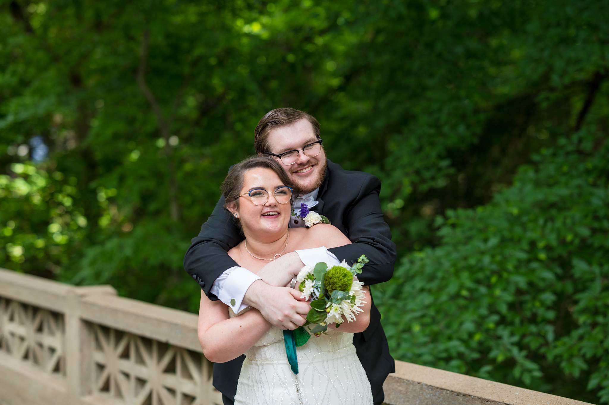 Couple laughing on the stone bridge on Emory’s campus