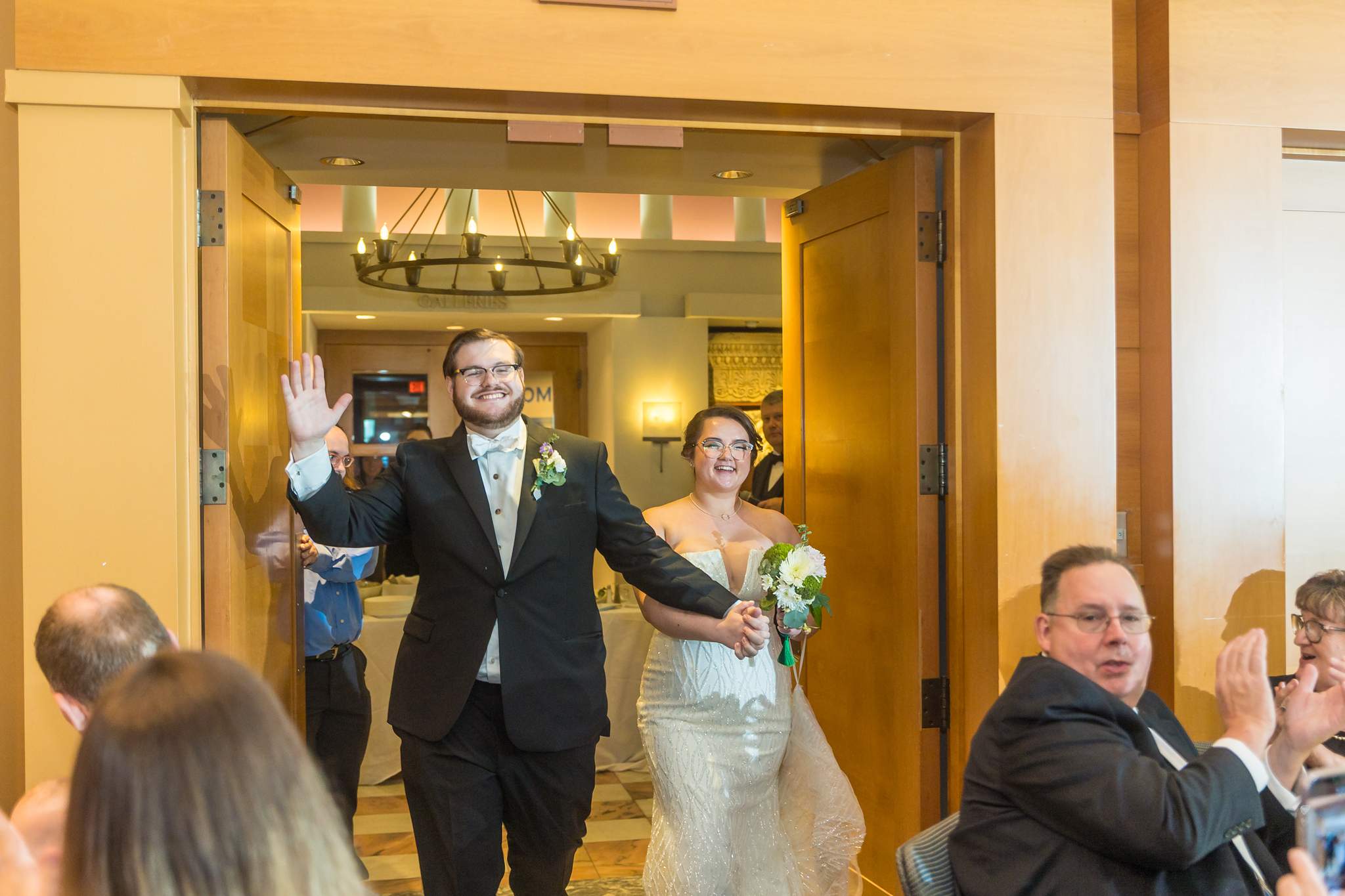 Couple making their grand entrance into Ackerman Hall