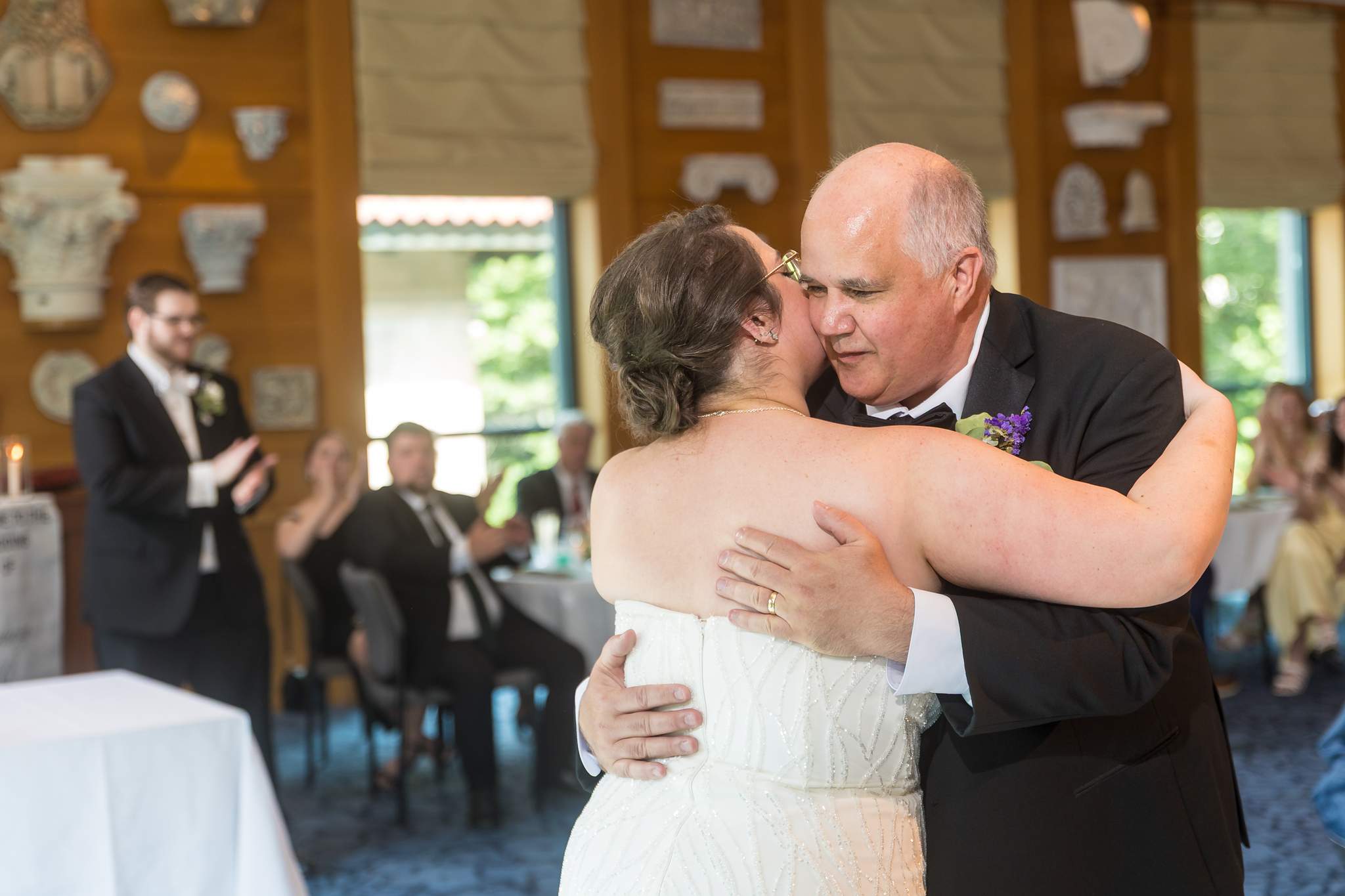 Bride dancing with a family member at a the Michael C. Carlos Museum reception