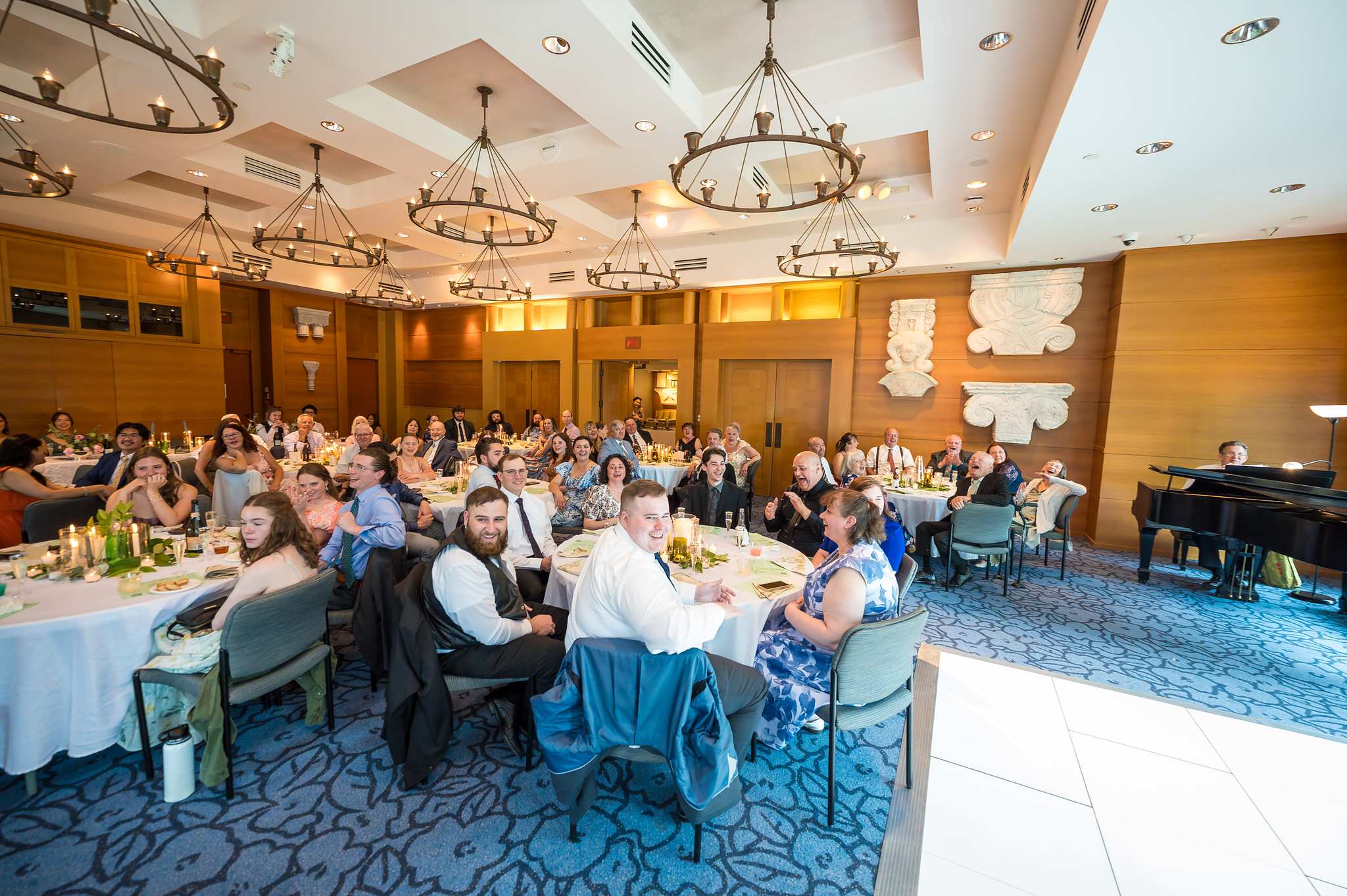 Wide view of a wedding reception and dance floor in Ackerman Hall