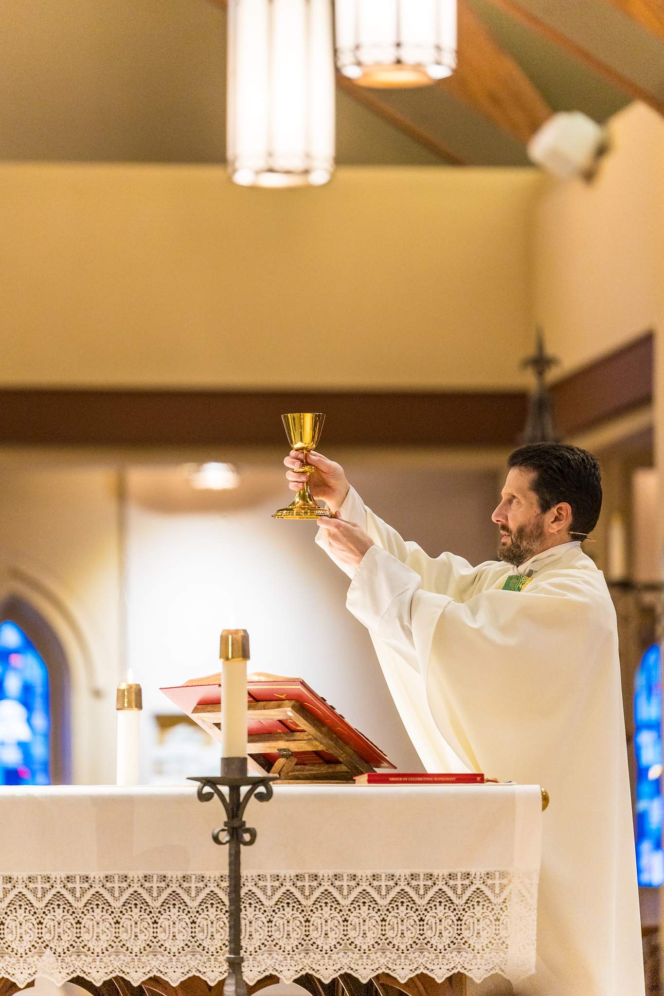 Priest celebrating the Eucharist during a wedding at Our Lady of the Assumption