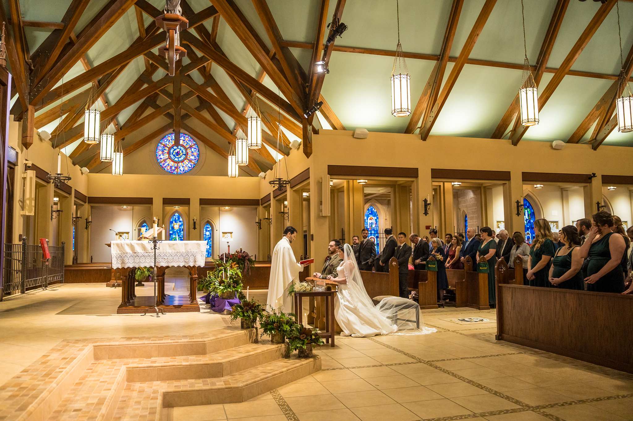 Side view of a Catholic wedding ceremony at Our Lady of the Assumption Catholic Church