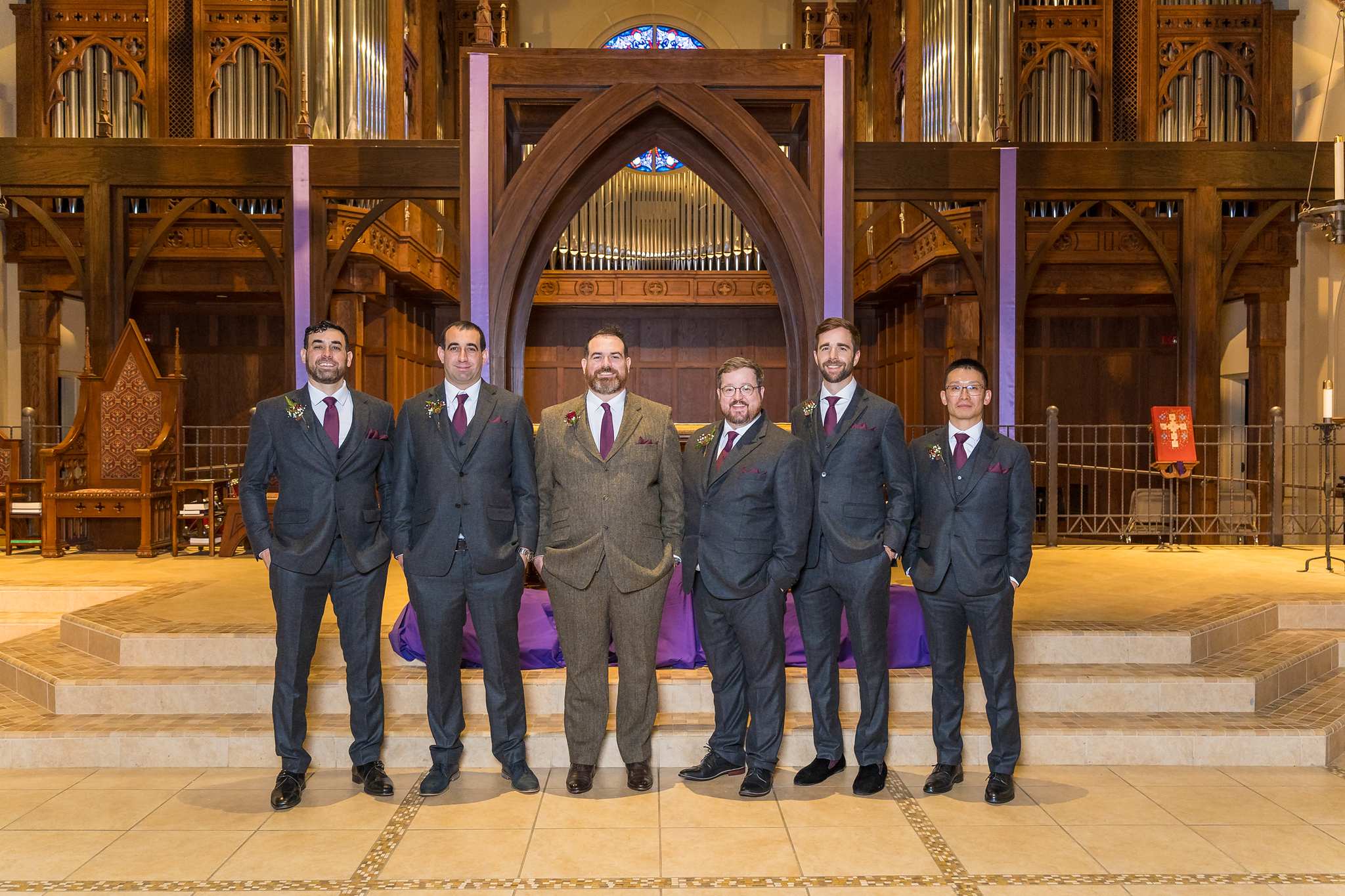 Groom and groomsmen in front of the altar at Our Lady of the Assumption