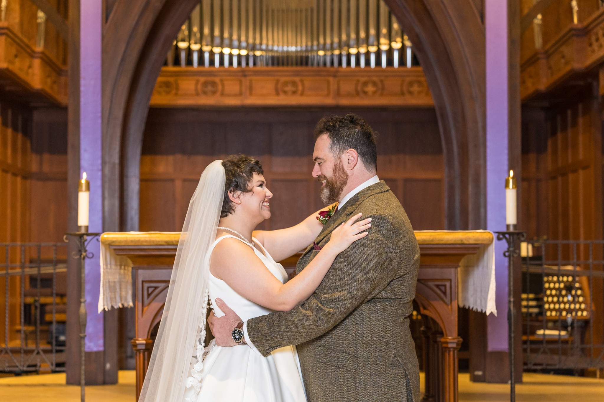Couple embracing at the altar of Our Lady of the Assumption Catholic Church