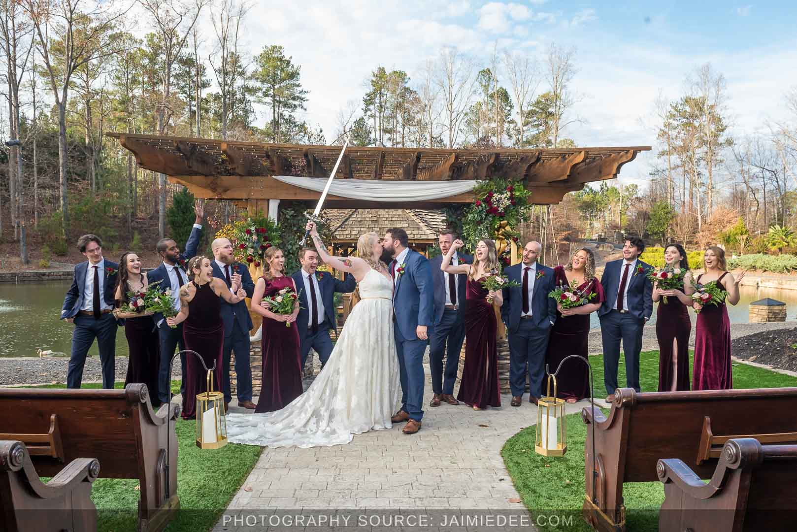 Rocky's Lake Estate Wedding Venue - bridal party portrait with full bridal party with sword