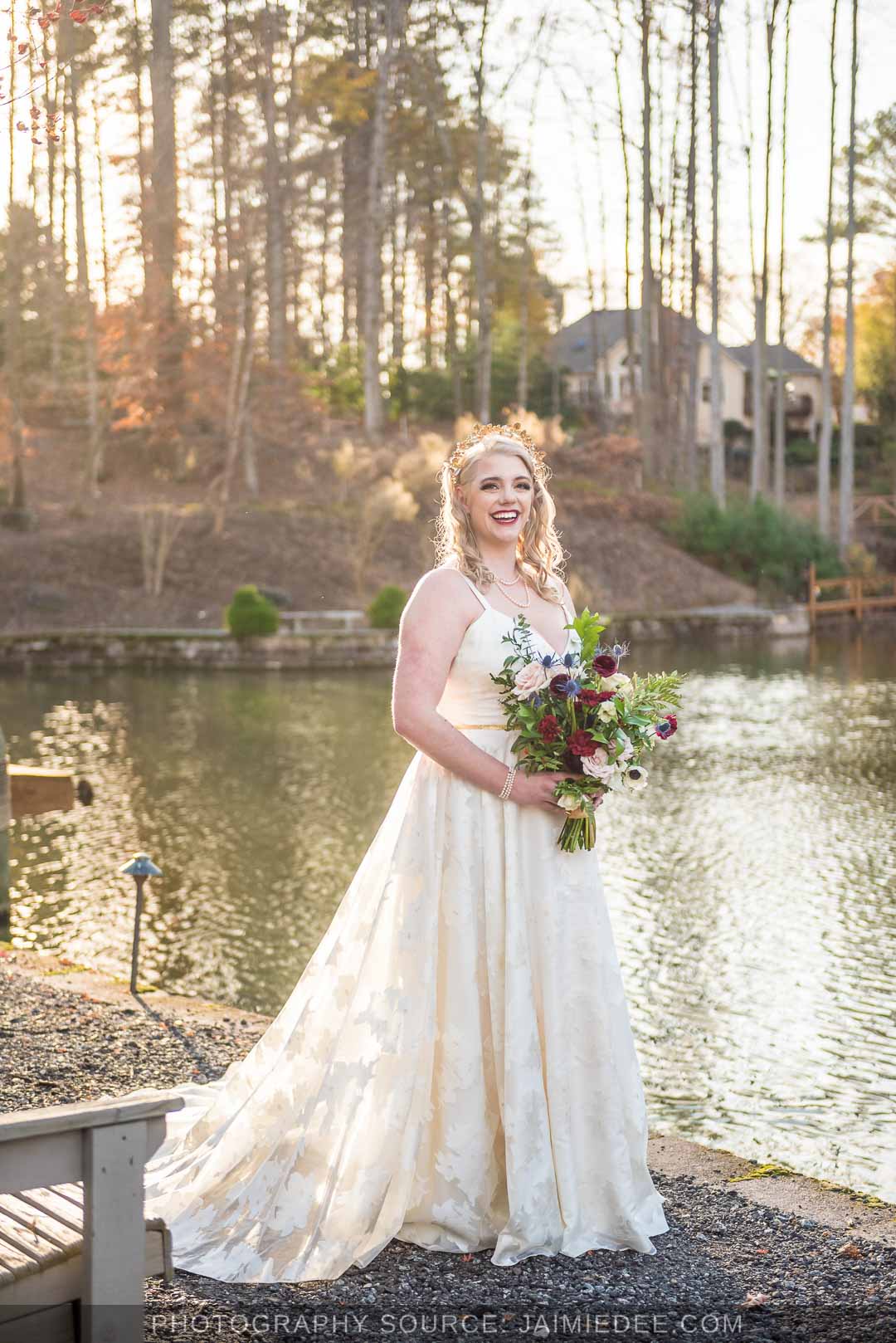 Rocky's Lake Estate Wedding Venue - Bridal Portraits - close up of bride on her wedding day holding bouquet of flowers - full body