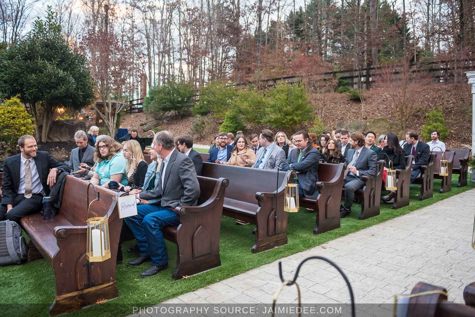 Rocky's Lake Estate Wedding Venue - Wedding ceremony - guests seated in outdoor pew benches