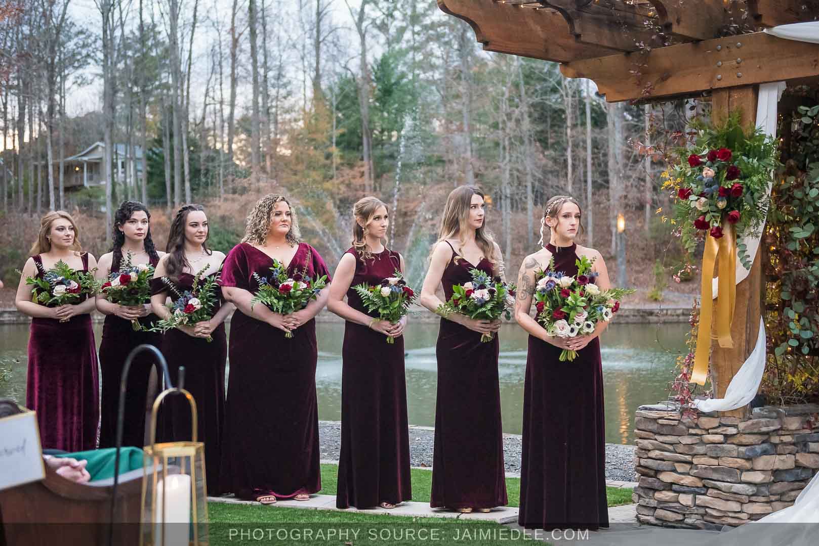 Rocky's Lake Estate Wedding Venue - Wedding ceremony - bridesmaids standing and watching the ceremony