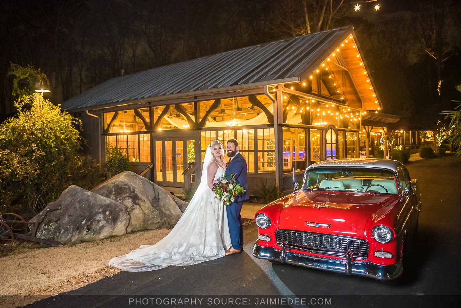 Rocky's Lake Estate Wedding Venue - bride and groom portrait - night time couples portraits in front of lit up venue with classic car