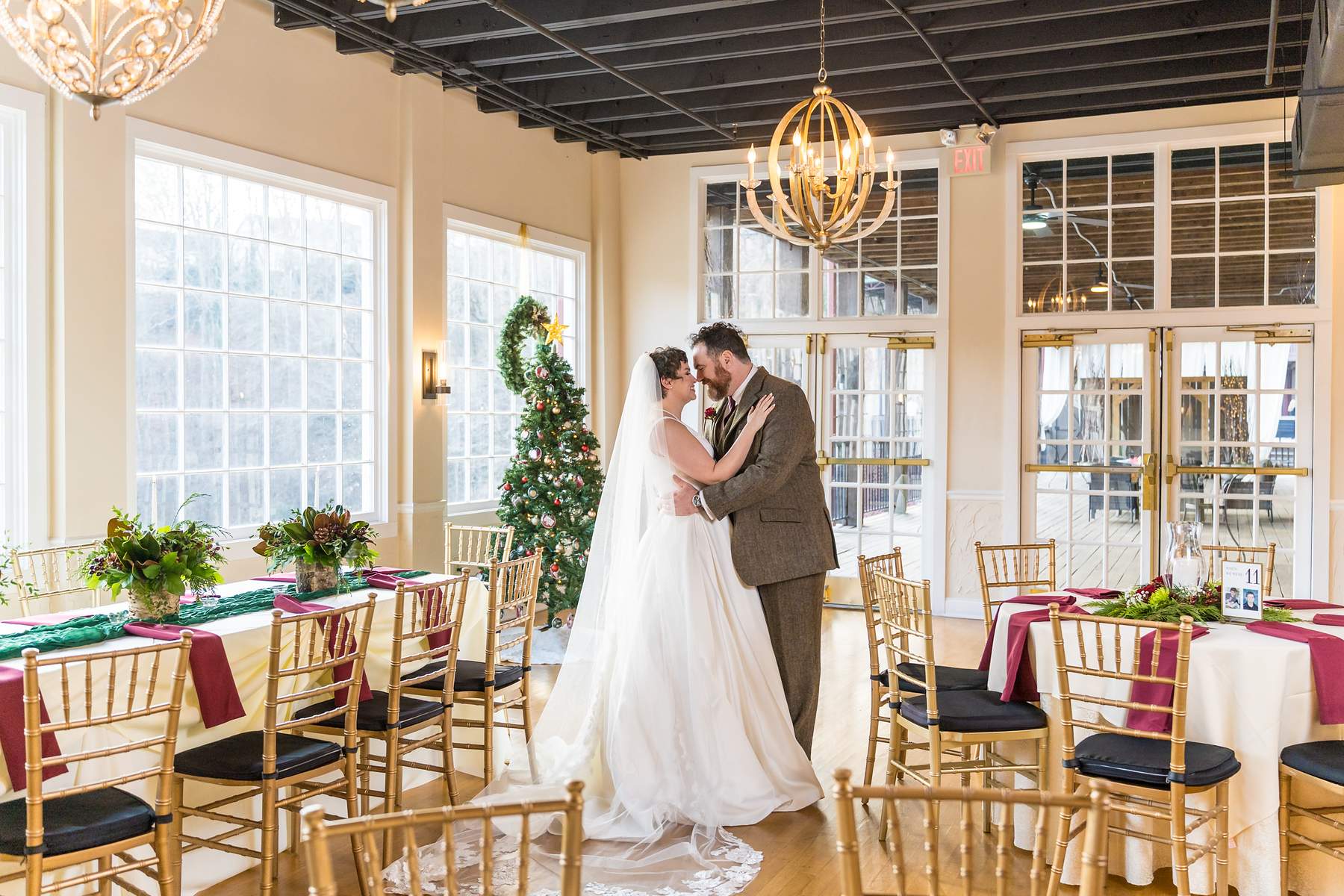 Couple slow dancing in the decorated reception room at Roswell Mill Club