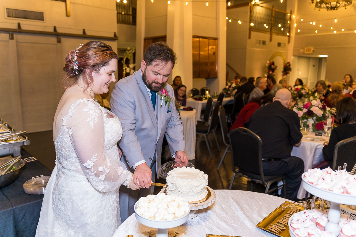 Roswell River Landing Wedding Photos of Cake Cutting