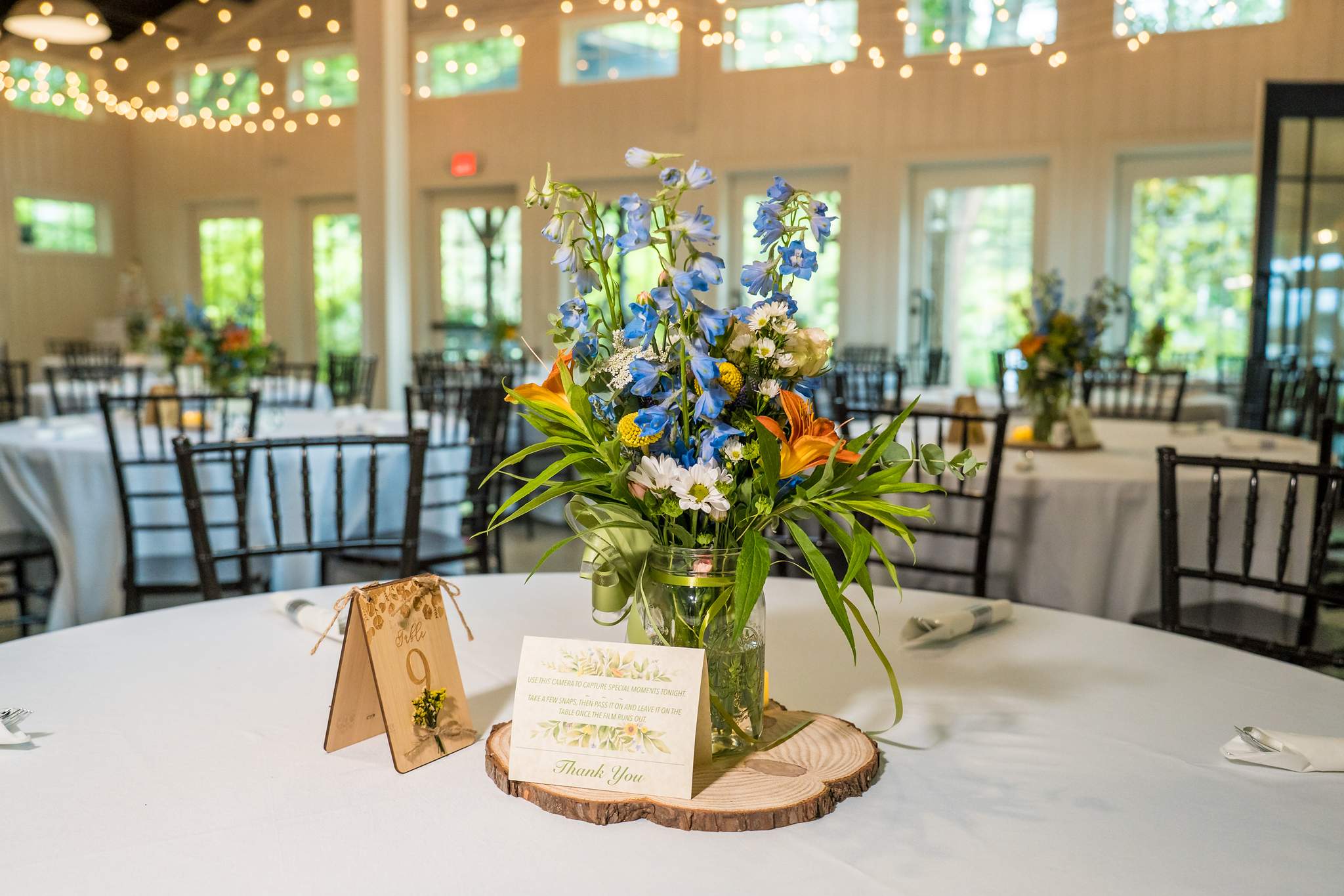 Wildflower centerpiece on a reception table in the Giaquinto Event Center