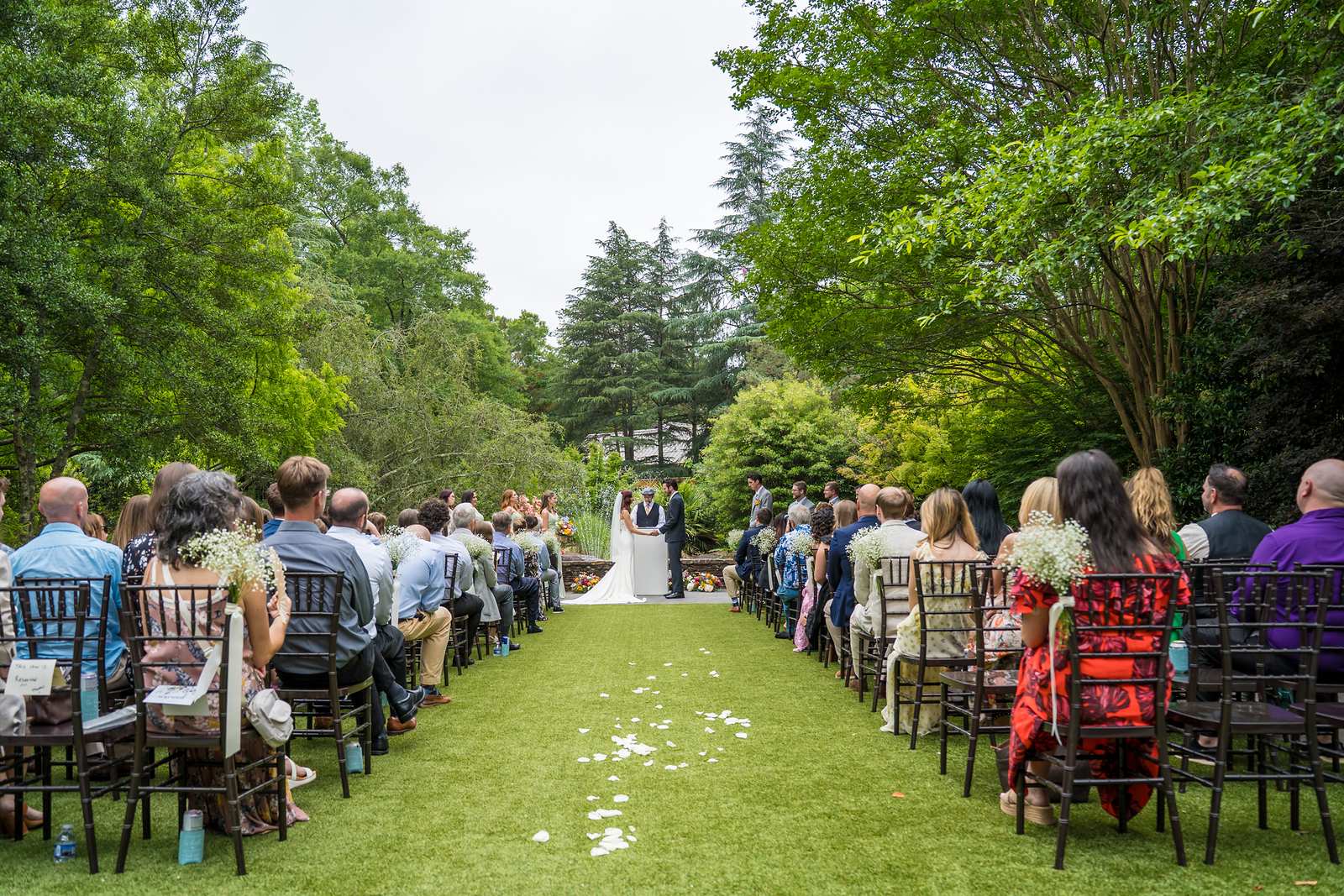 Guests seated on the ceremony lawn during a Shiloh Gardens wedding