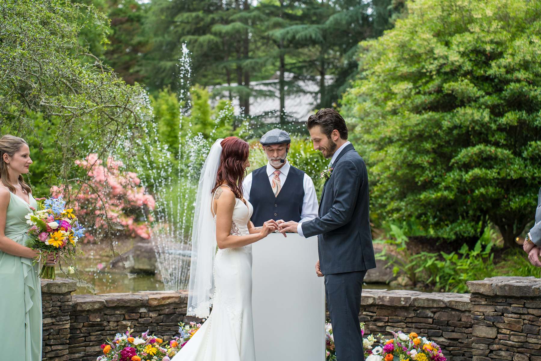 Ring exchange during an outdoor wedding ceremony at Shiloh Gardens