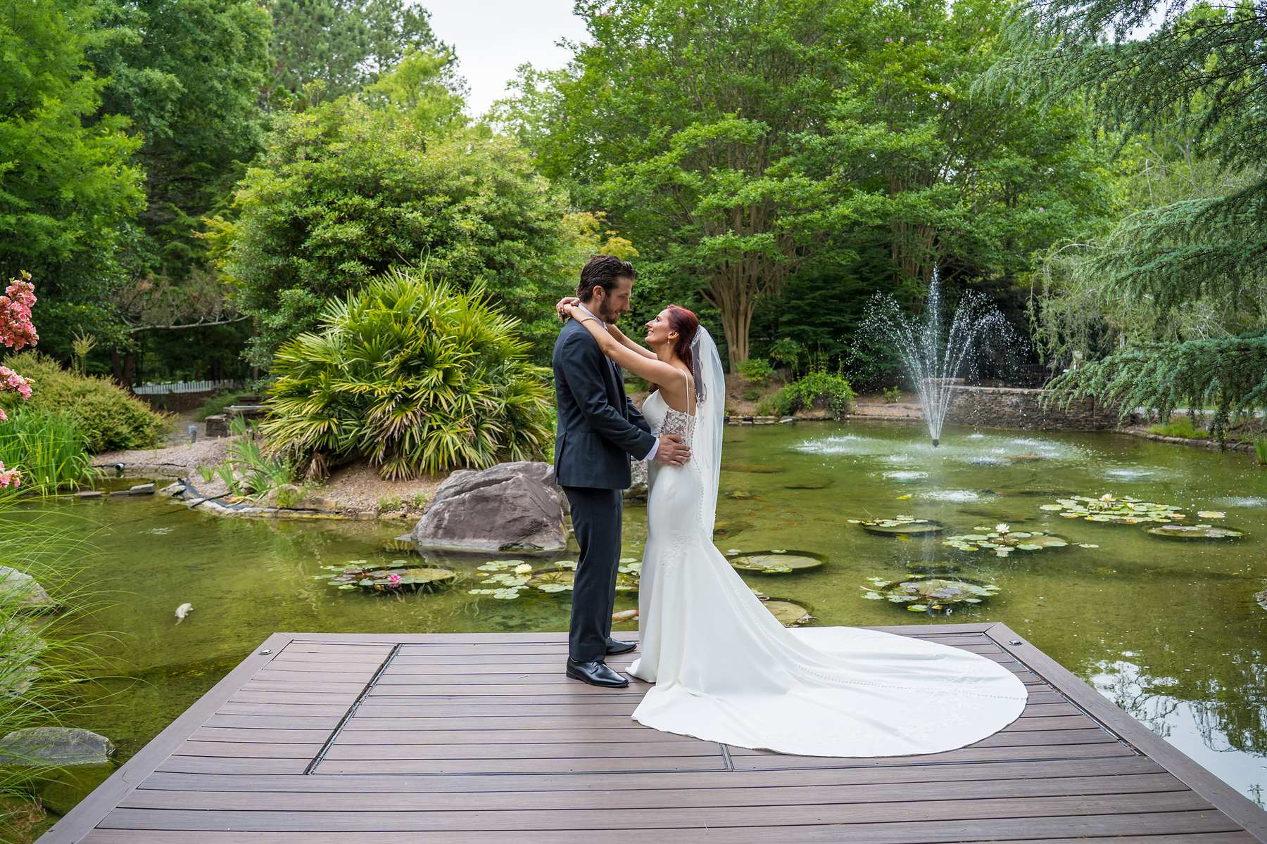 Couple on the dock over the lily pond at Shiloh Gardens Special Events Venue