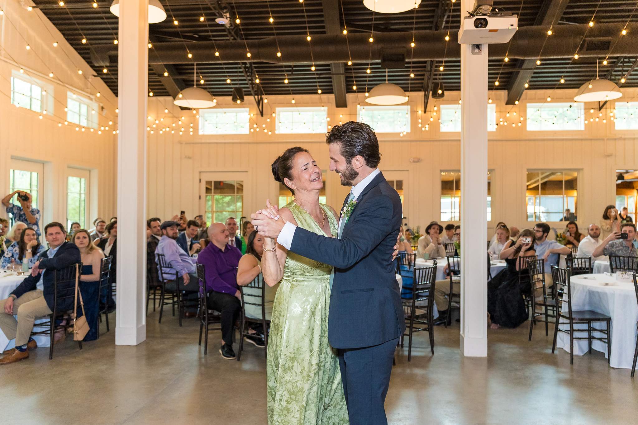 Groom dancing with a family member at a Shiloh Gardens wedding reception