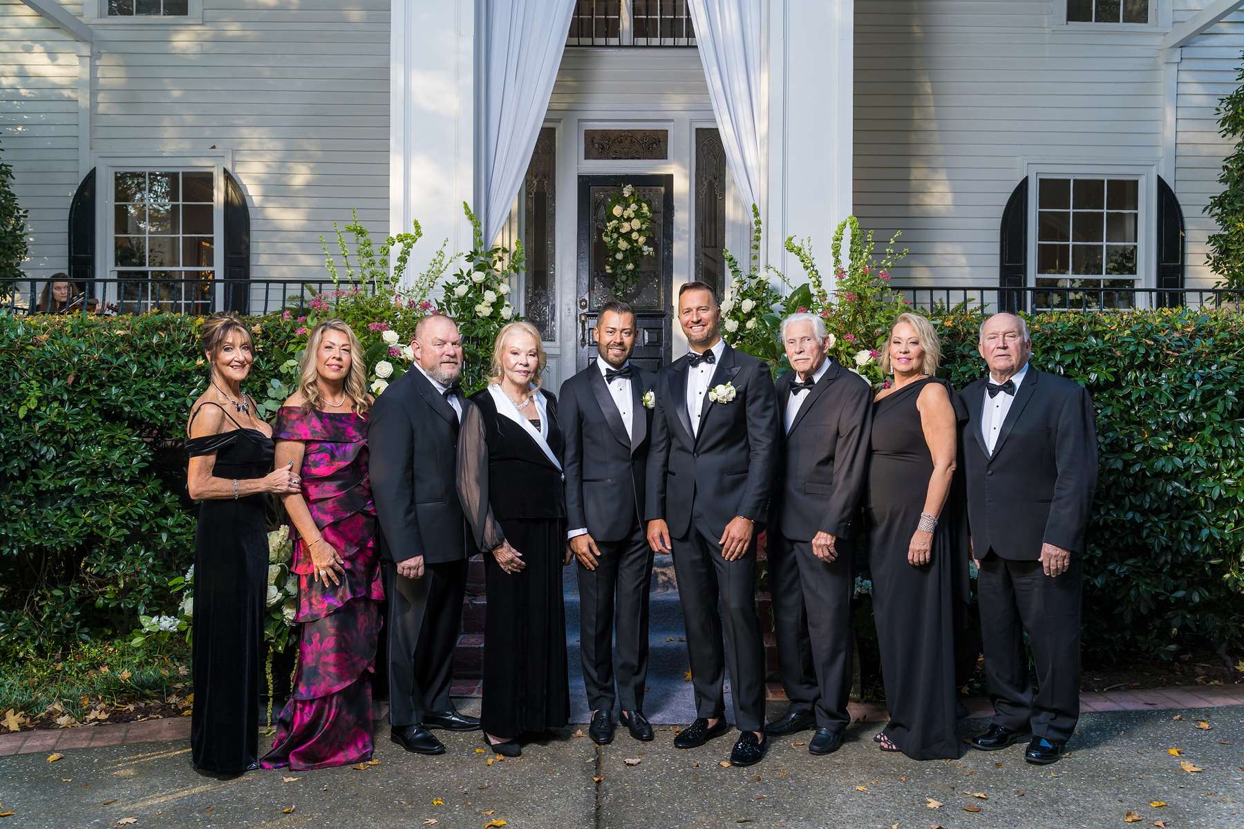Wedding party in black tie on the front walk at The Cedars in Acworth