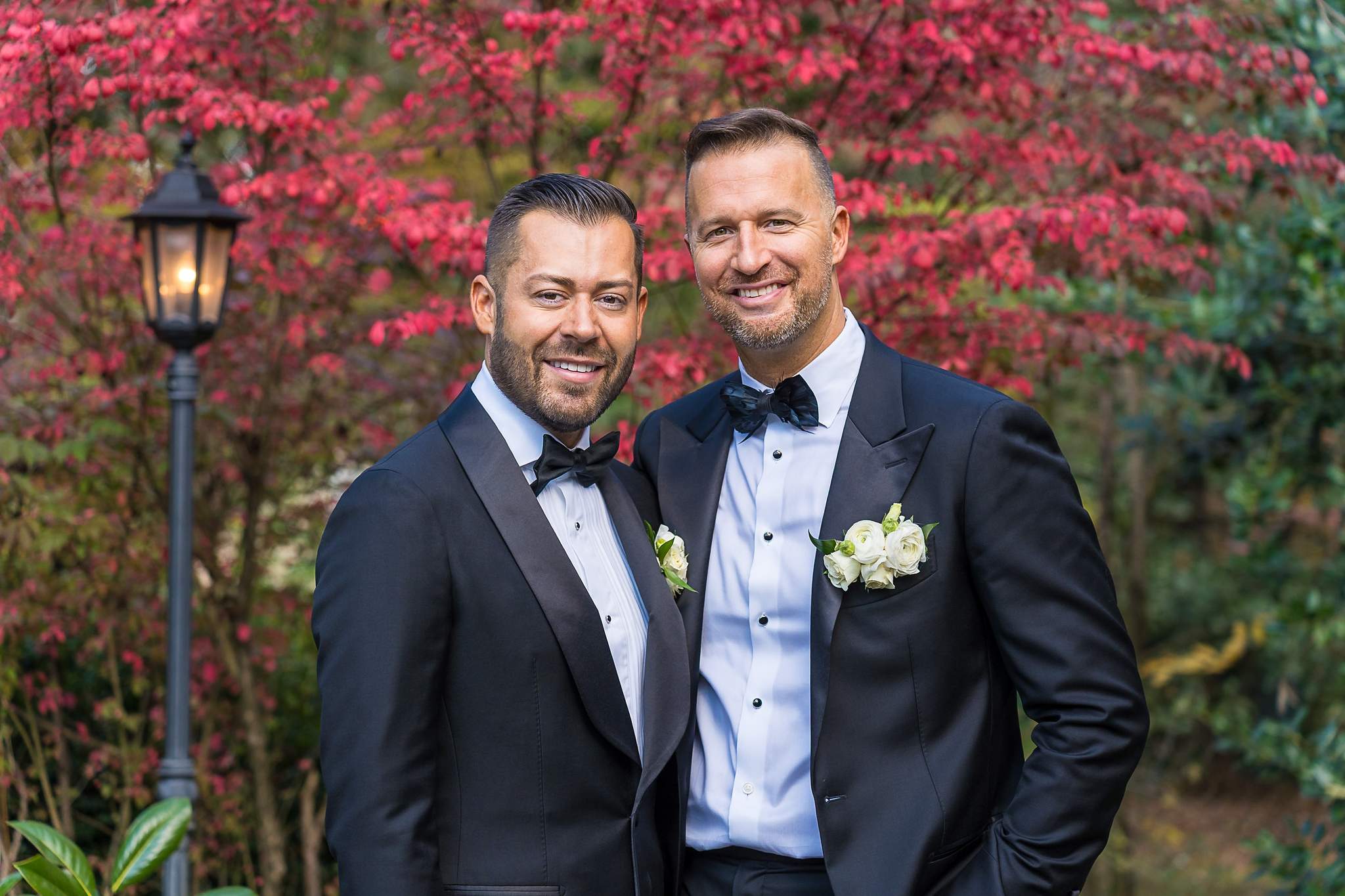 Couple portrait in front of a red Japanese maple at The Cedars in Acworth