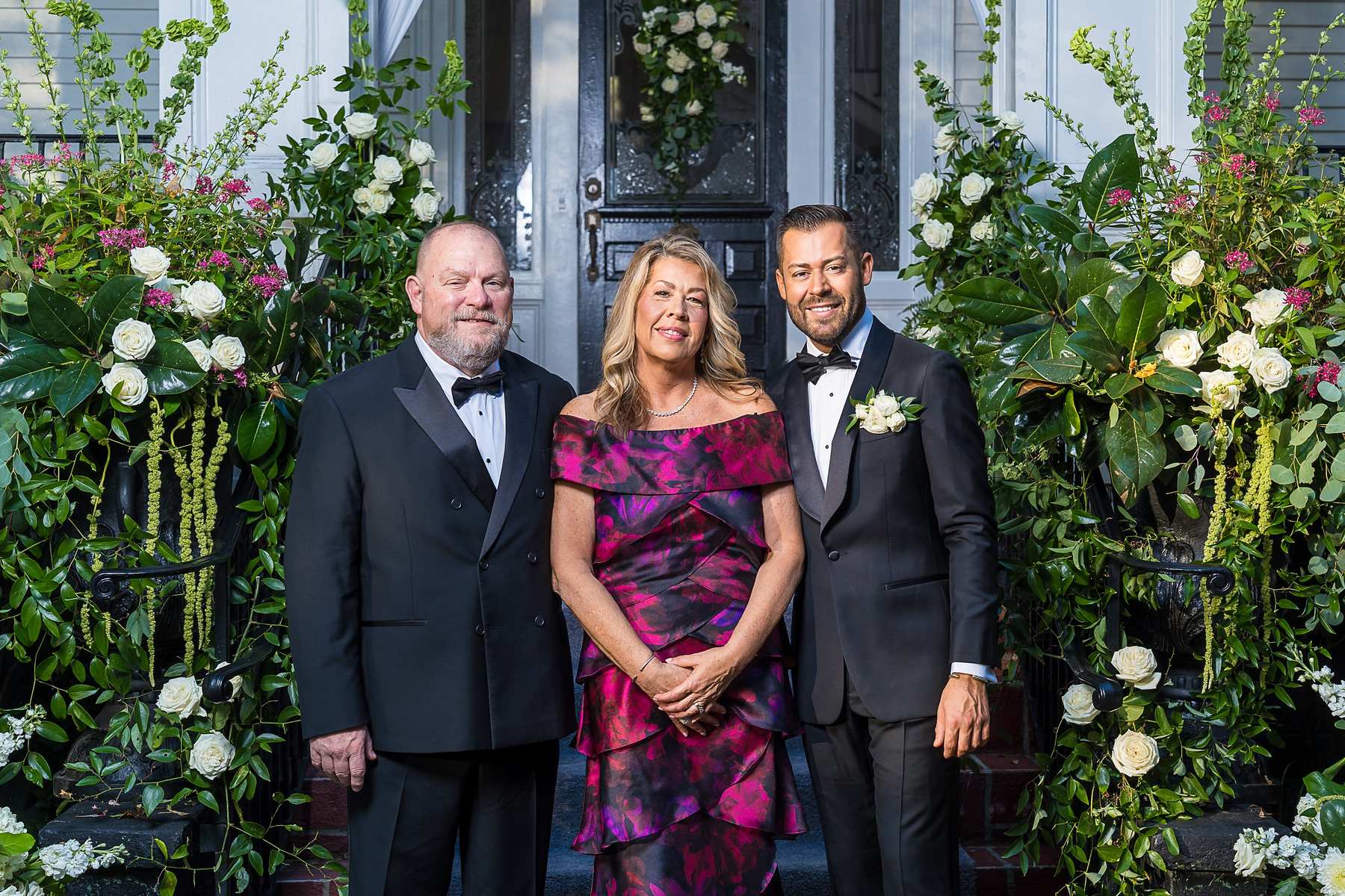 Couple with a family member on the front steps at The Cedars in Acworth