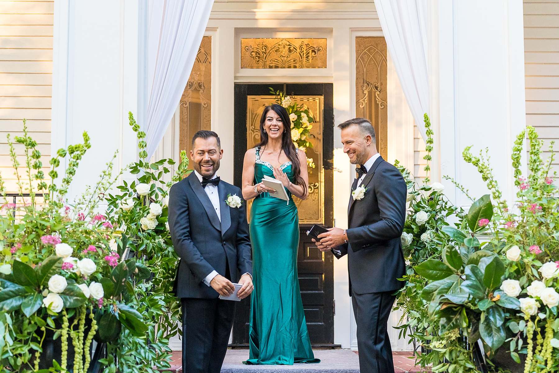Couple and officiant on the front steps during their ceremony at The Cedars in Acworth