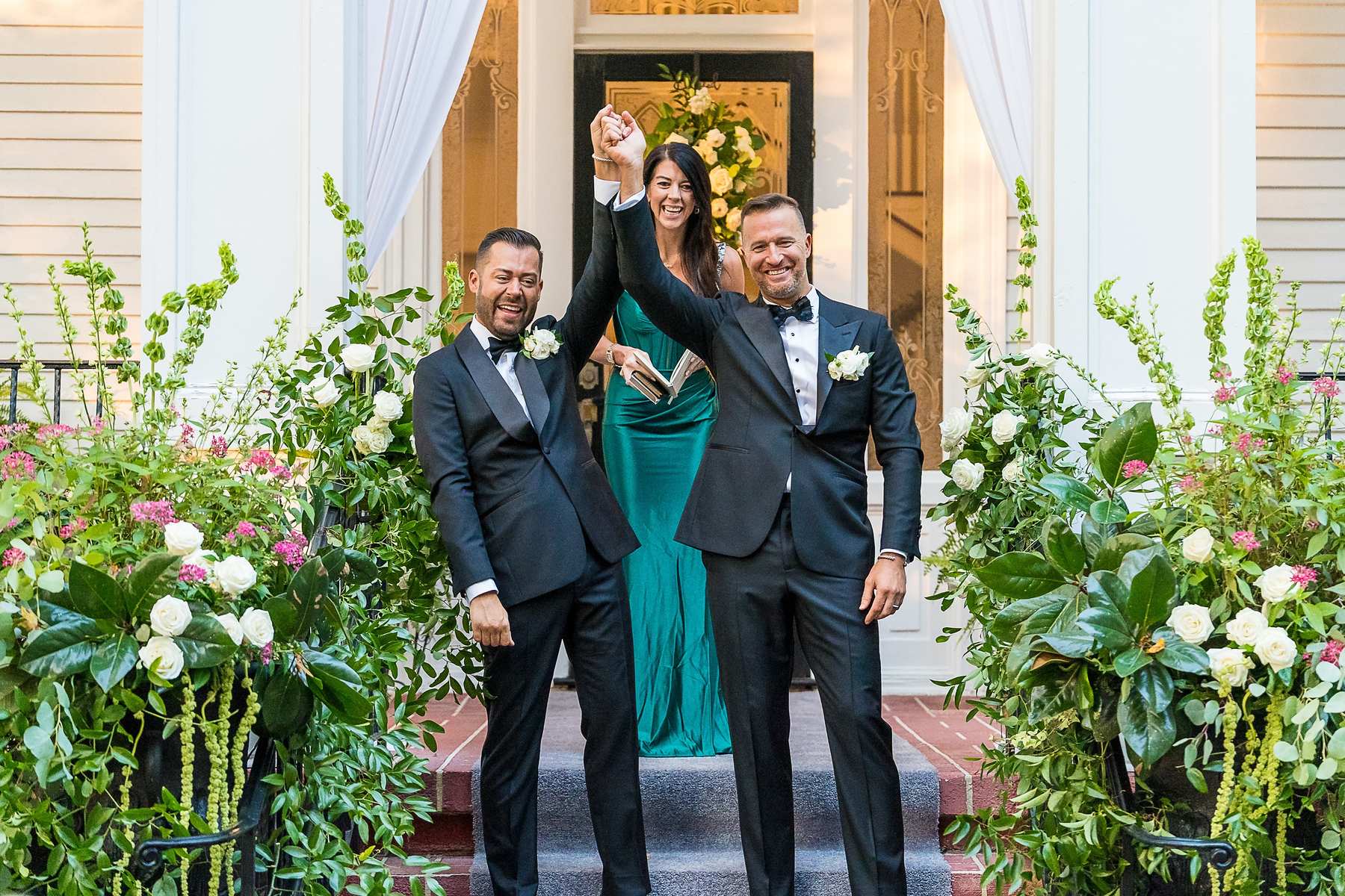 Officiant celebrating with the couple on the front steps at The Cedars in Acworth