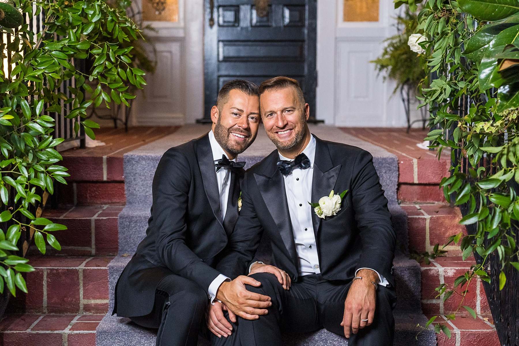 Couple seated together on the brick steps at The Cedars in Acworth