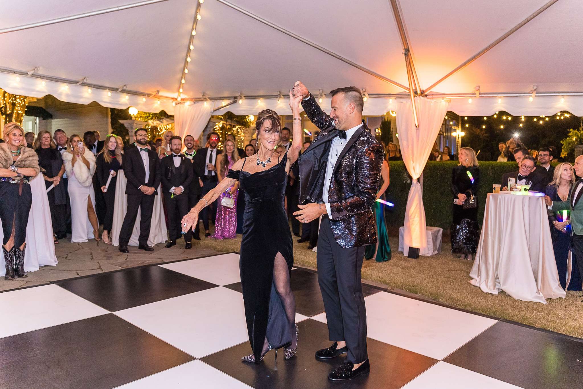 Dancing on a checkered dance floor under the tent at The Cedars in Acworth
