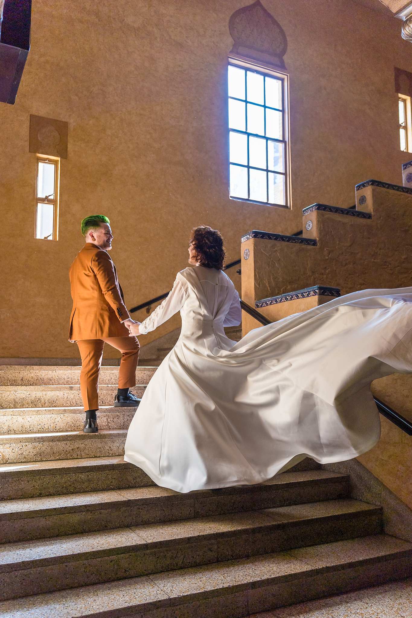 Wedding gown flowing on the stairs inside the Fox Theatre