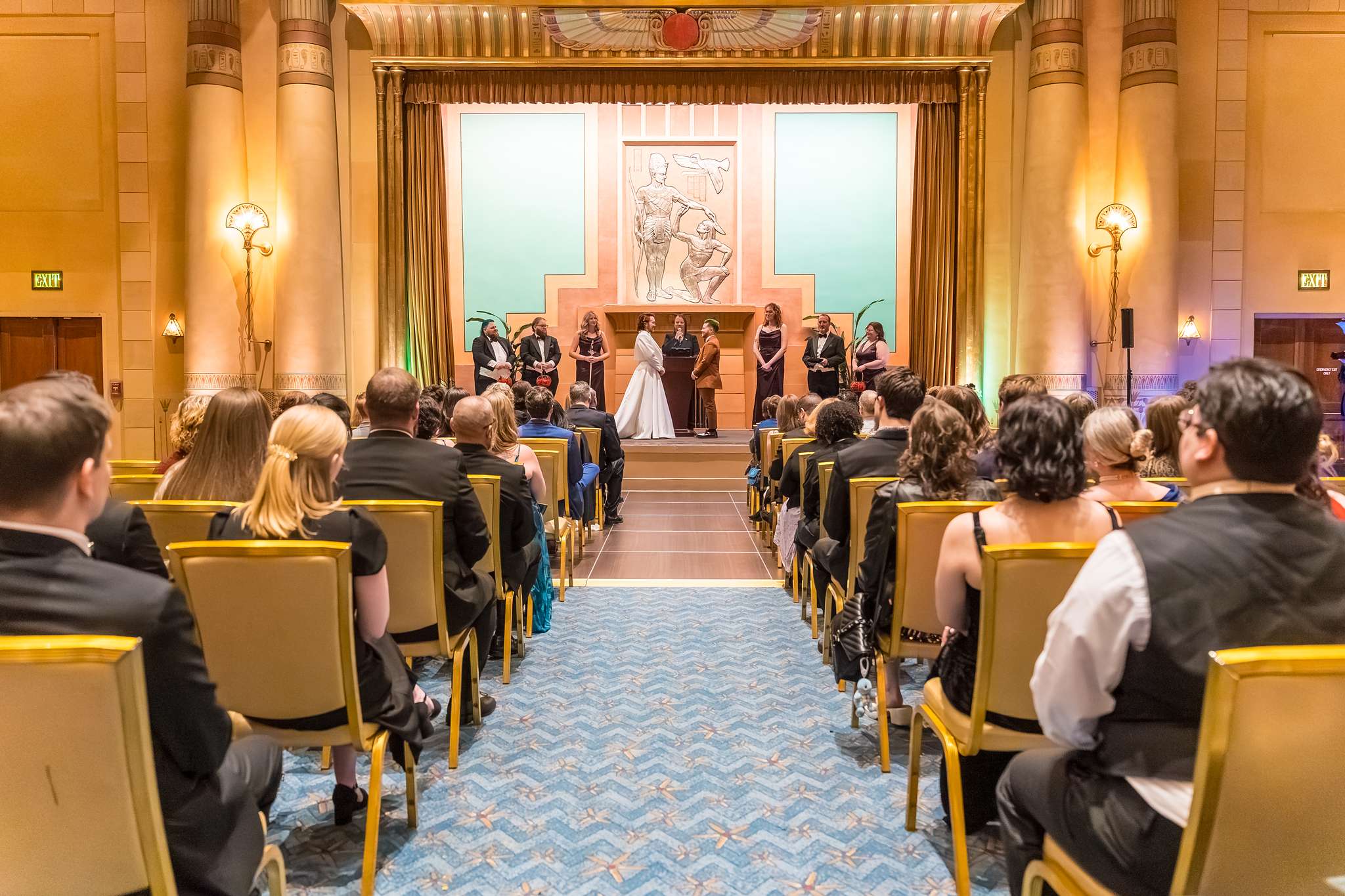 Guests seated for a wedding ceremony in the Fox Theatre Egyptian Ballroom