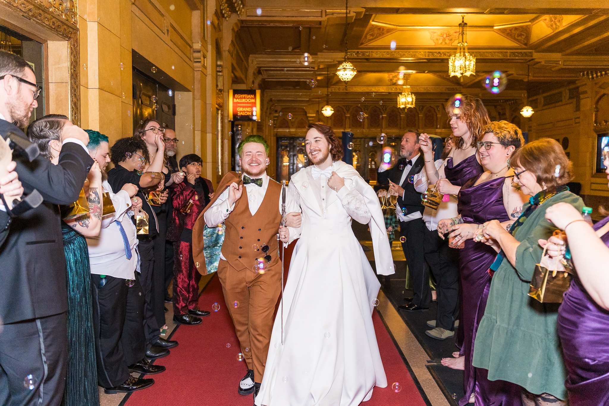 Guests lining up to celebrate the couple at the end of a Fox Theatre wedding