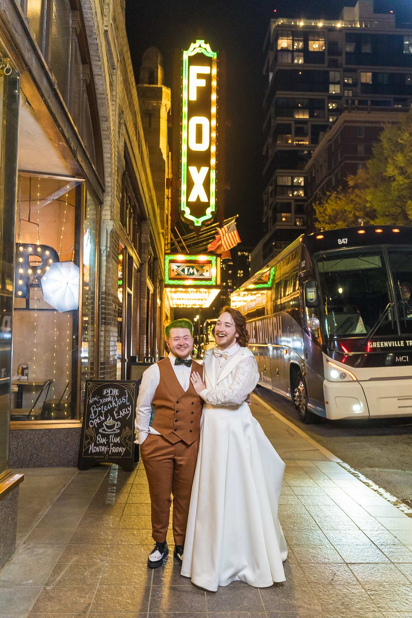 Night wedding portrait with the glowing Fox sign on Peachtree Street