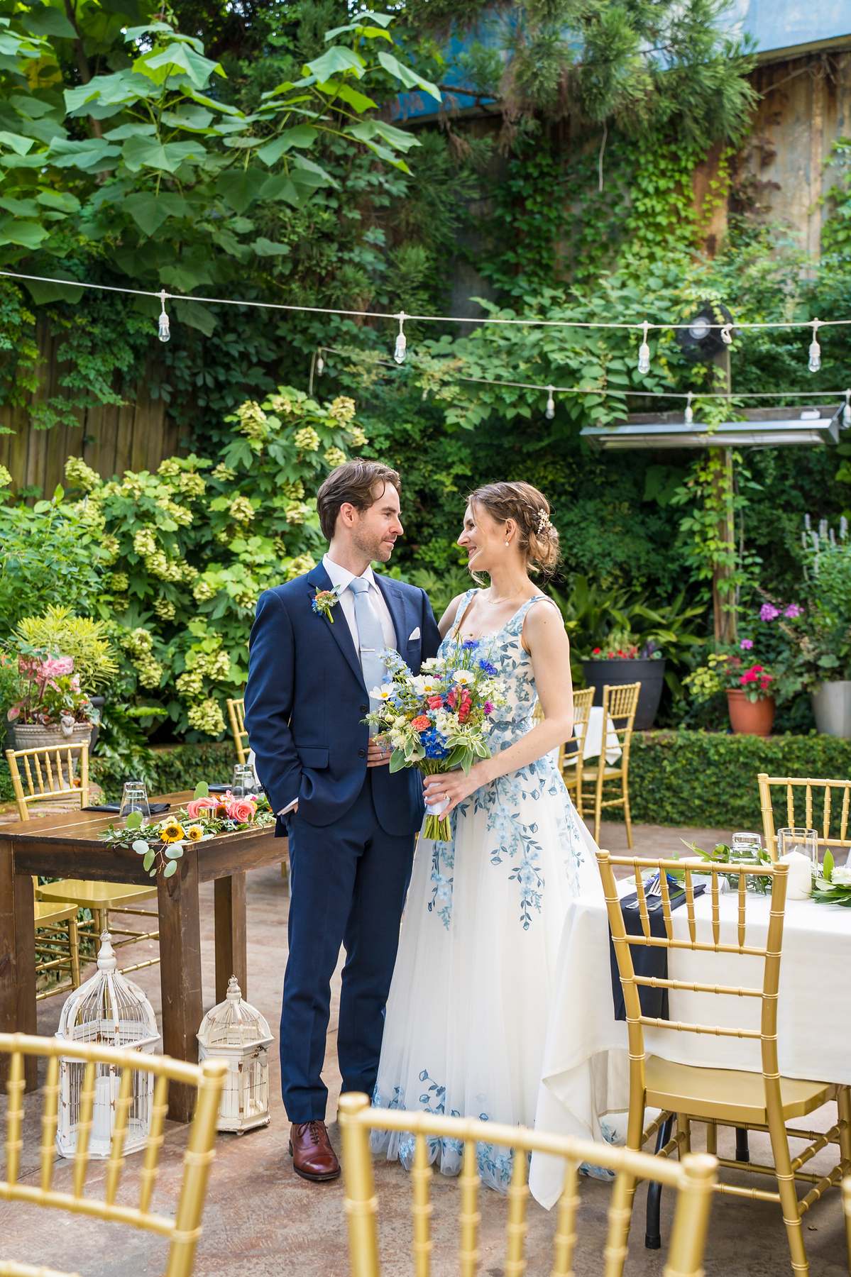 Couple portrait among the garden greenery at Wahoo! Grill in Decatur