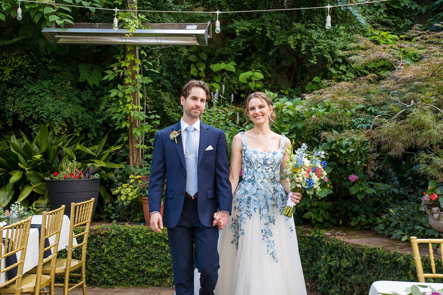 Couple standing on the garden patio at Wahoo! Grill