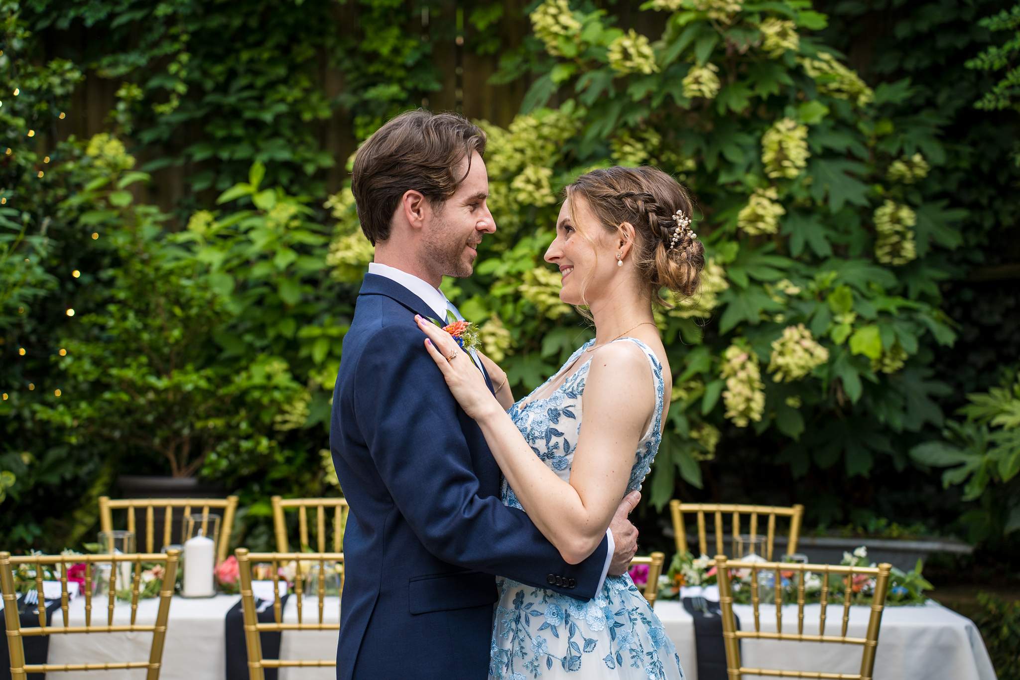Couple embracing in the lush garden at Wahoo! Grill in Decatur