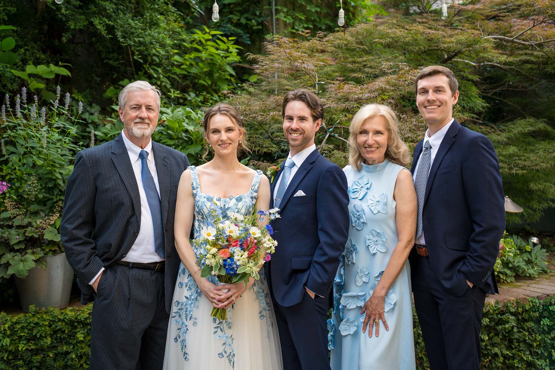 Family portrait in the garden at a Wahoo! Grill wedding