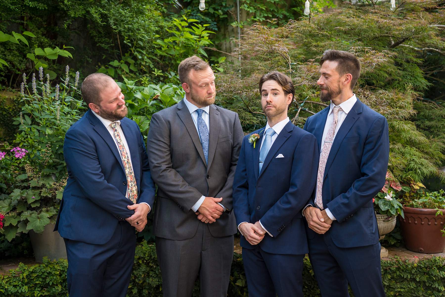 Groom with groomsmen in the garden at Wahoo! Grill
