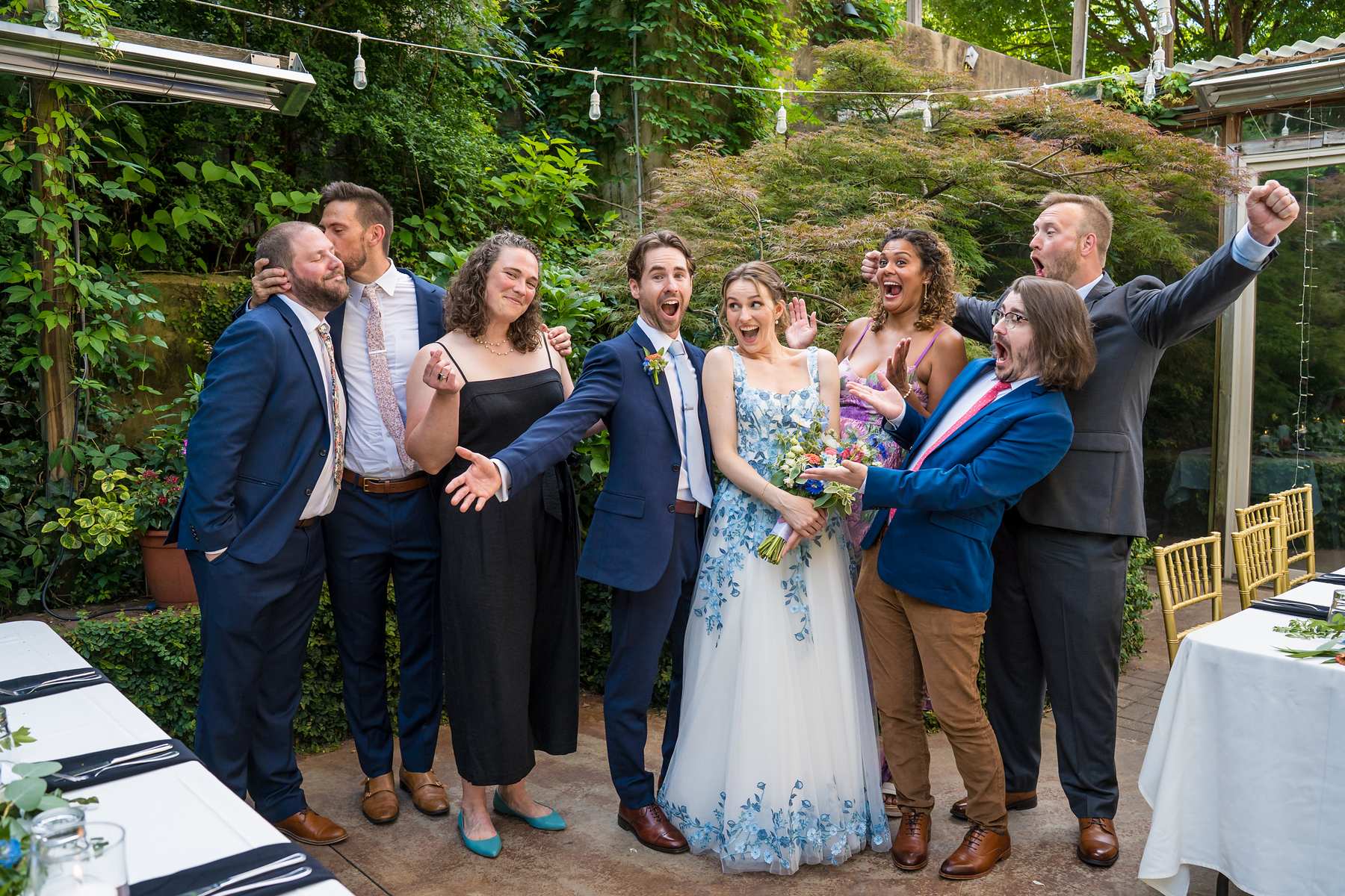 Wedding party celebrating on the garden patio at Wahoo! Grill