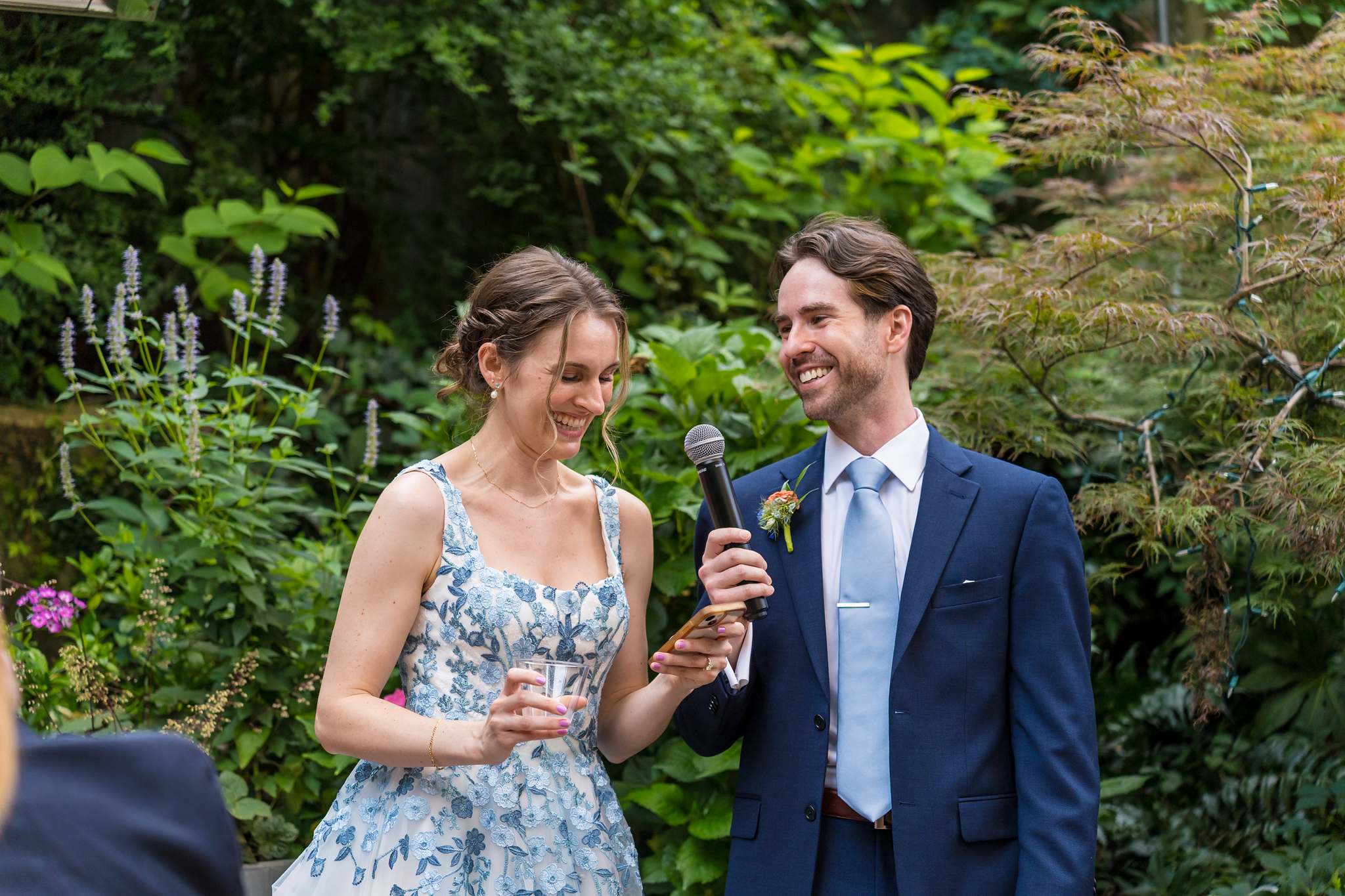 Couple speaking to guests in the garden at Wahoo! Grill