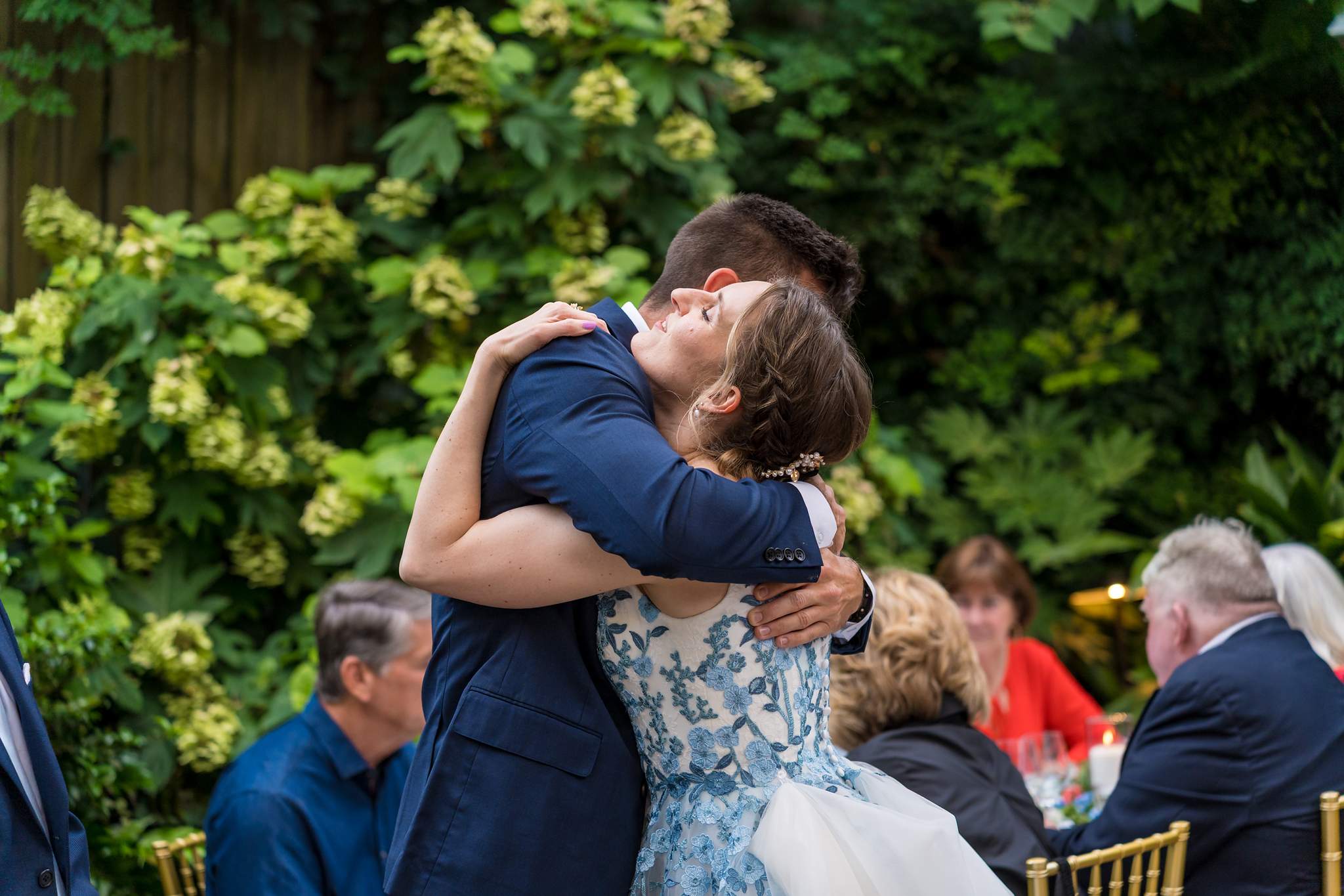 Bride hugging a guest at her Wahoo! Grill wedding