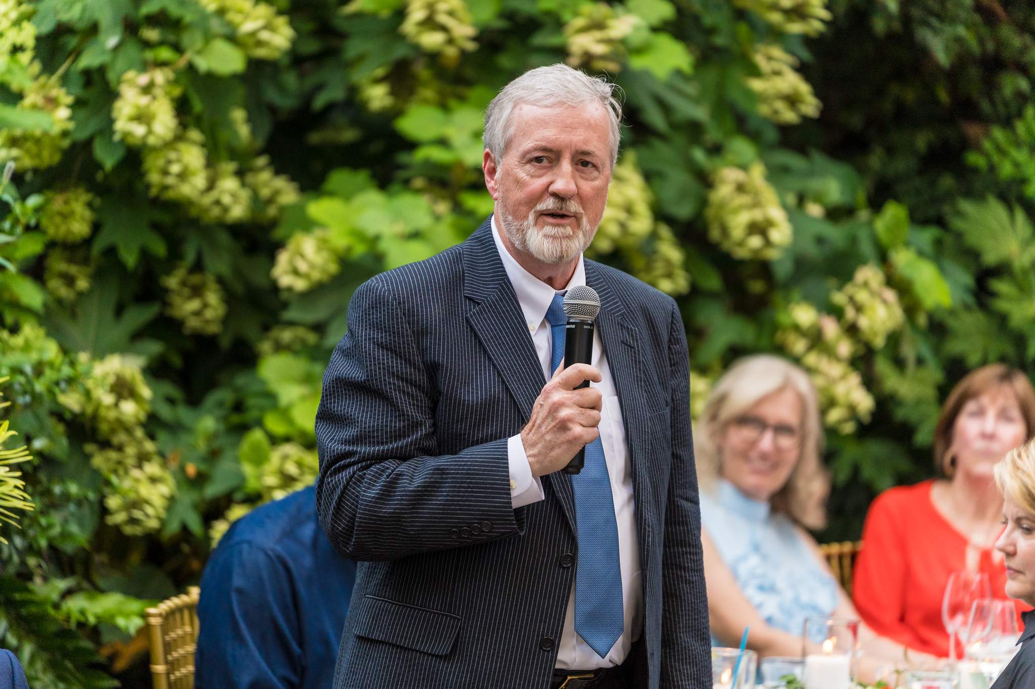 Toast in the garden during a Wahoo! Grill wedding reception