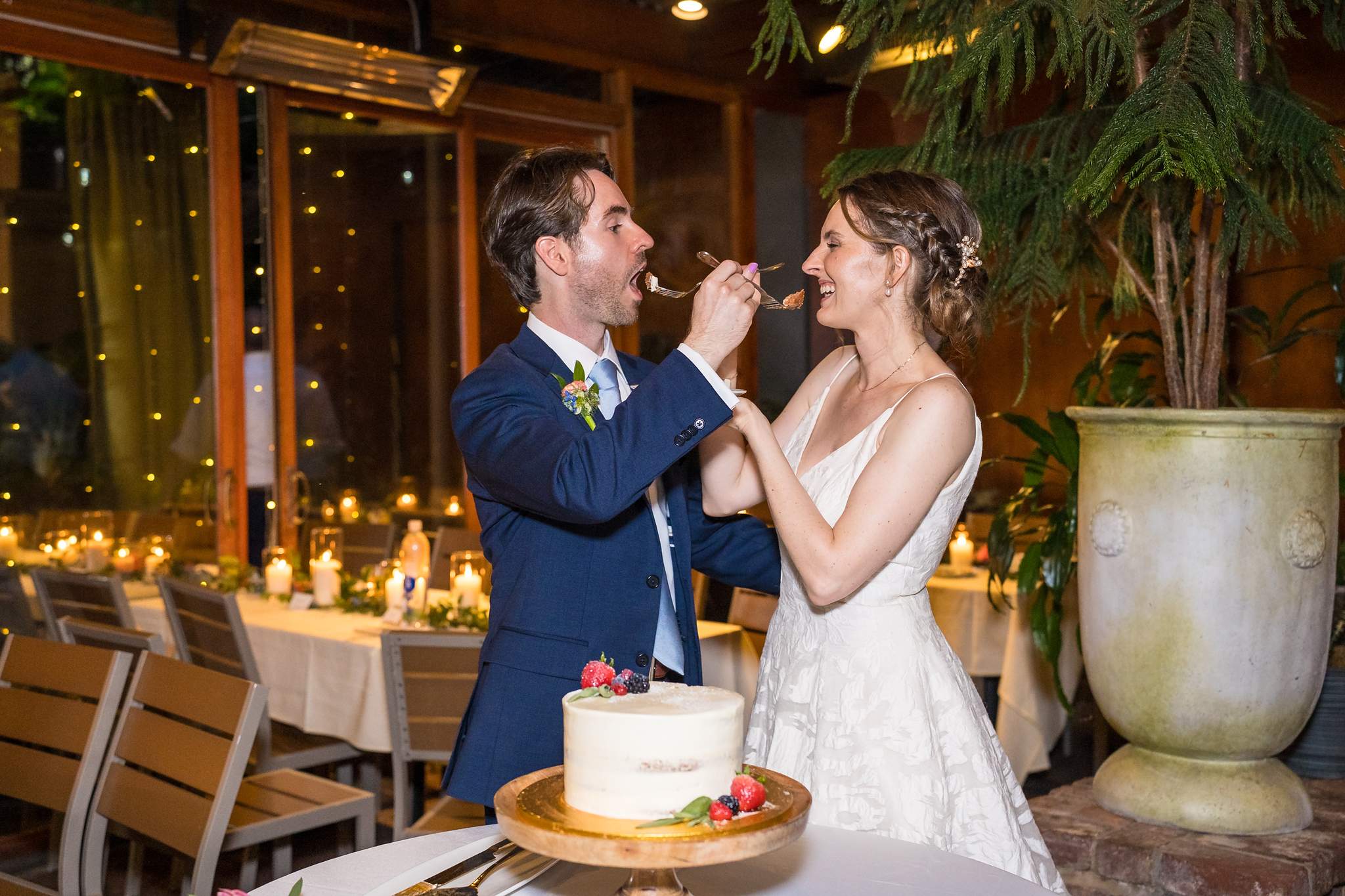 Couple feeding each other cake at a Wahoo! Grill reception