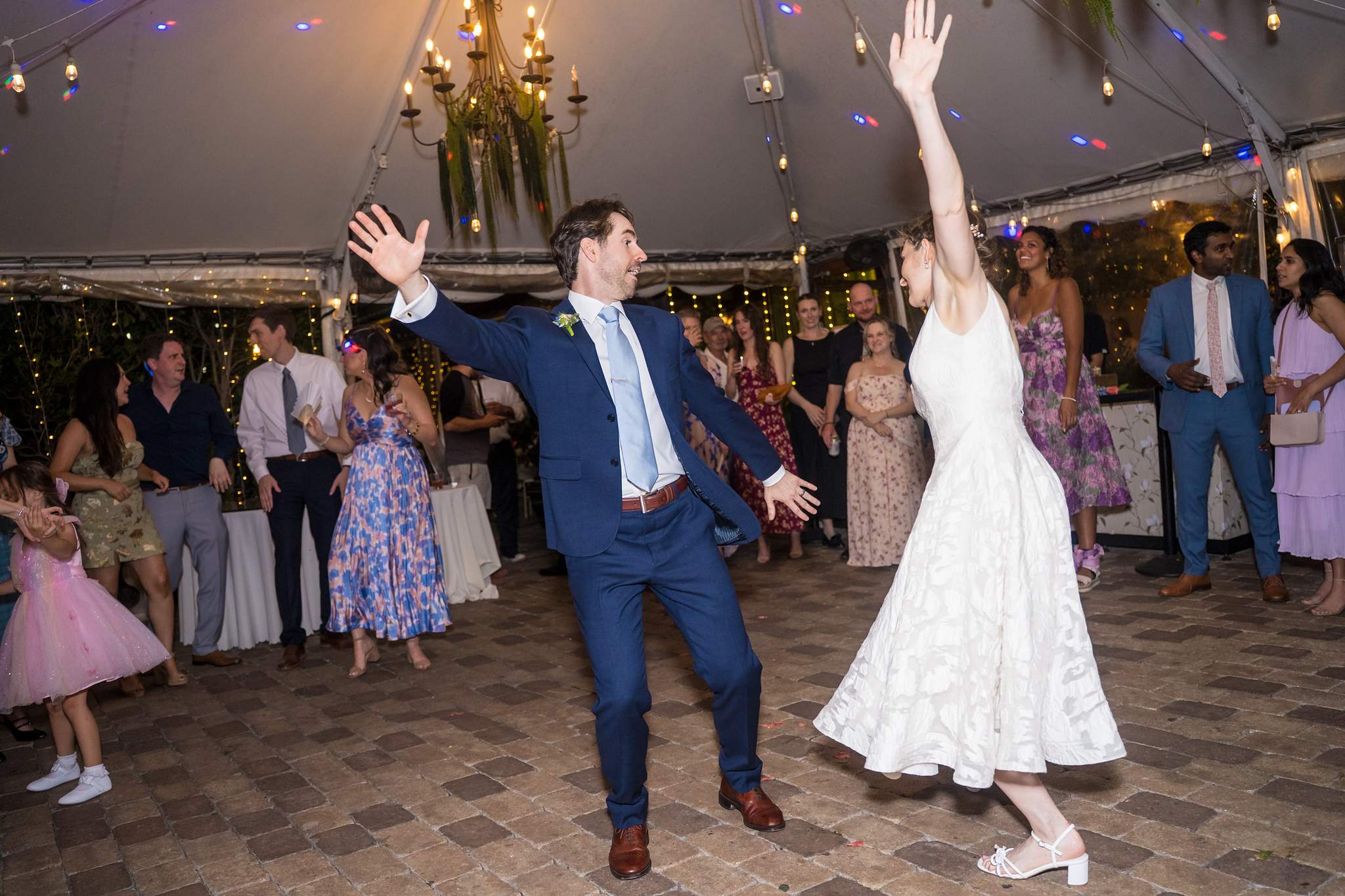 Couple dancing on the dance floor under the tent at Wahoo! Grill